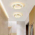 Luminaire rond aluminium design pour couloir moderne.