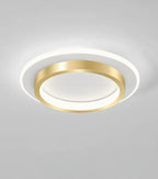 Plafonnier LED moderne forme ronde or eclairage doux.