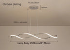 Suspension aluminium forme vague avec eclairage chaud.