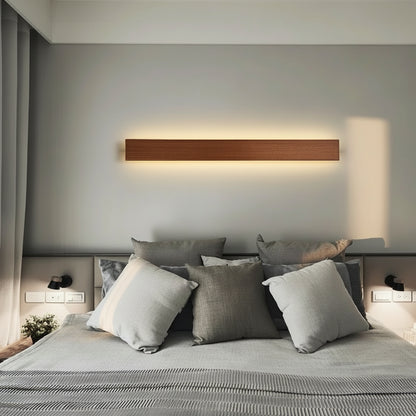 Applique murale LED LumaBar en bronze moderne.