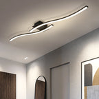 Vue latérale du plafonnier LED moderne ondulé en métal noir.